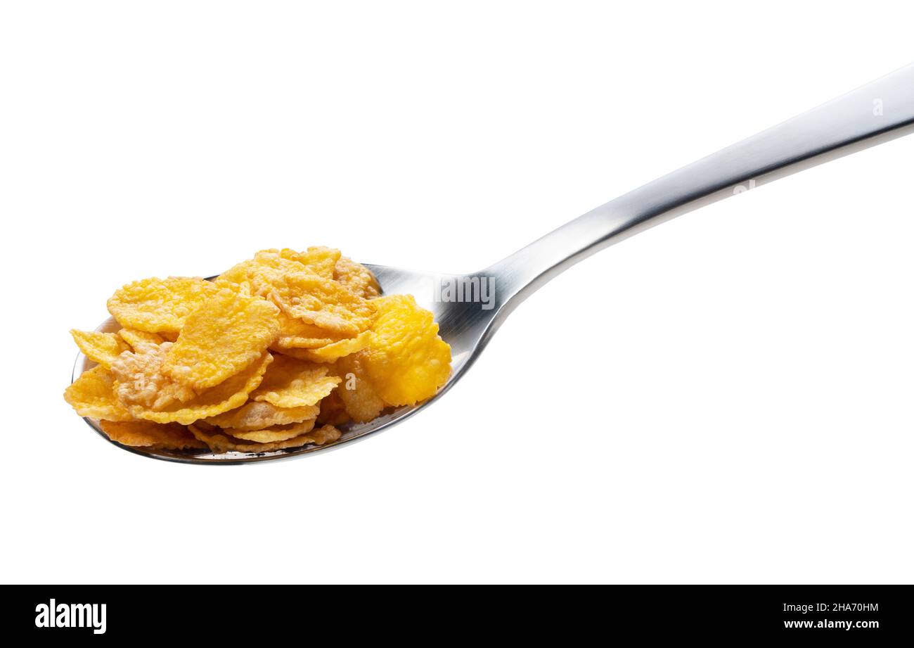 Corn flakes on the spoon isolated on white Stock Photo