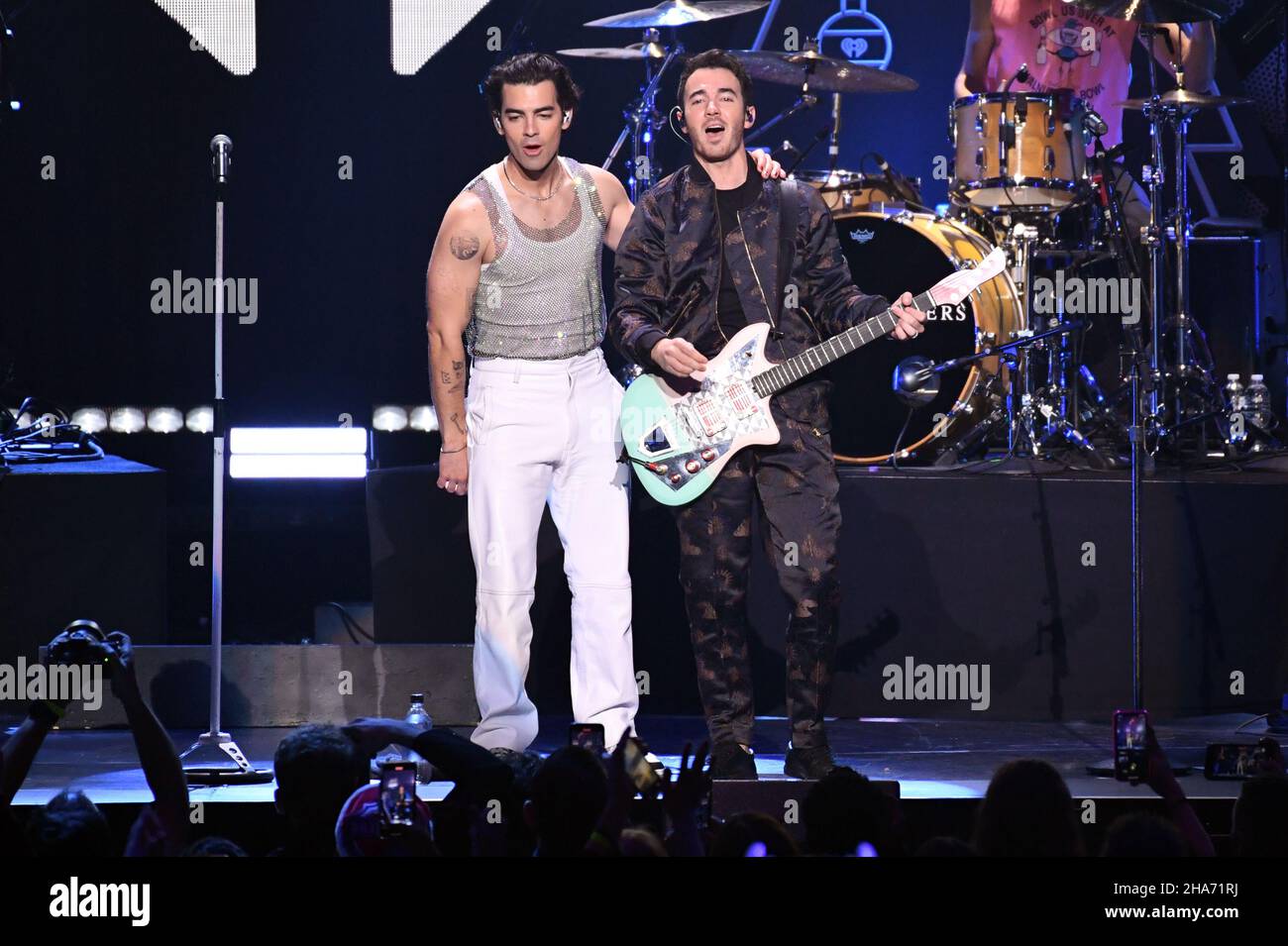 New York, USA. 10th Dec, 2021. (L-R) Joe Jonas and Kevin Jonas of the Jonas Brothers perform during the Z100's iHeart Radio Jingle Ball 2021 show at Madison Square Garden in New York, NY, December 10, 2021. (Photo by Anthony Behar/Sipa USA) Credit: Sipa USA/Alamy Live News Stock Photo