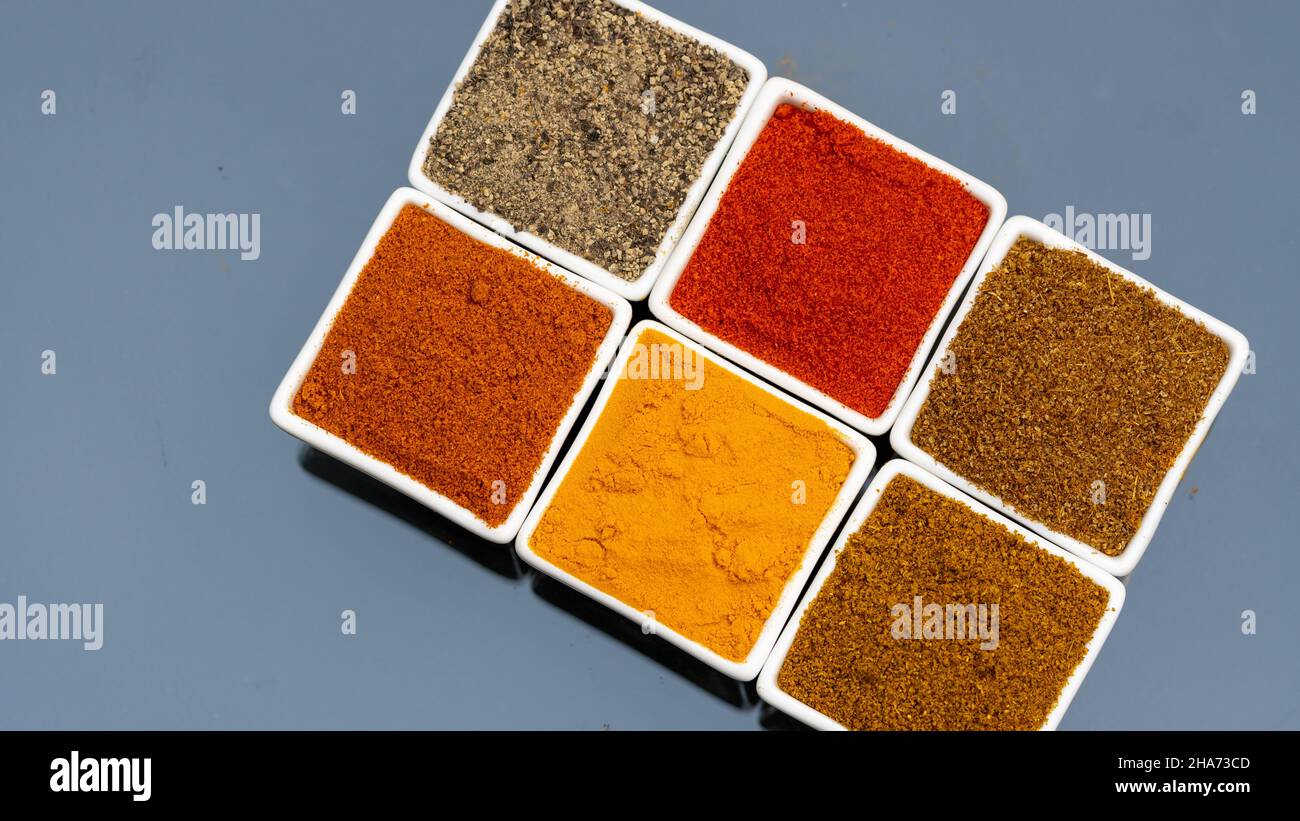 Colorful Spices: Top View of Chilli, Turmeric, Pepper, Curry Powder, and More! Stock Photo