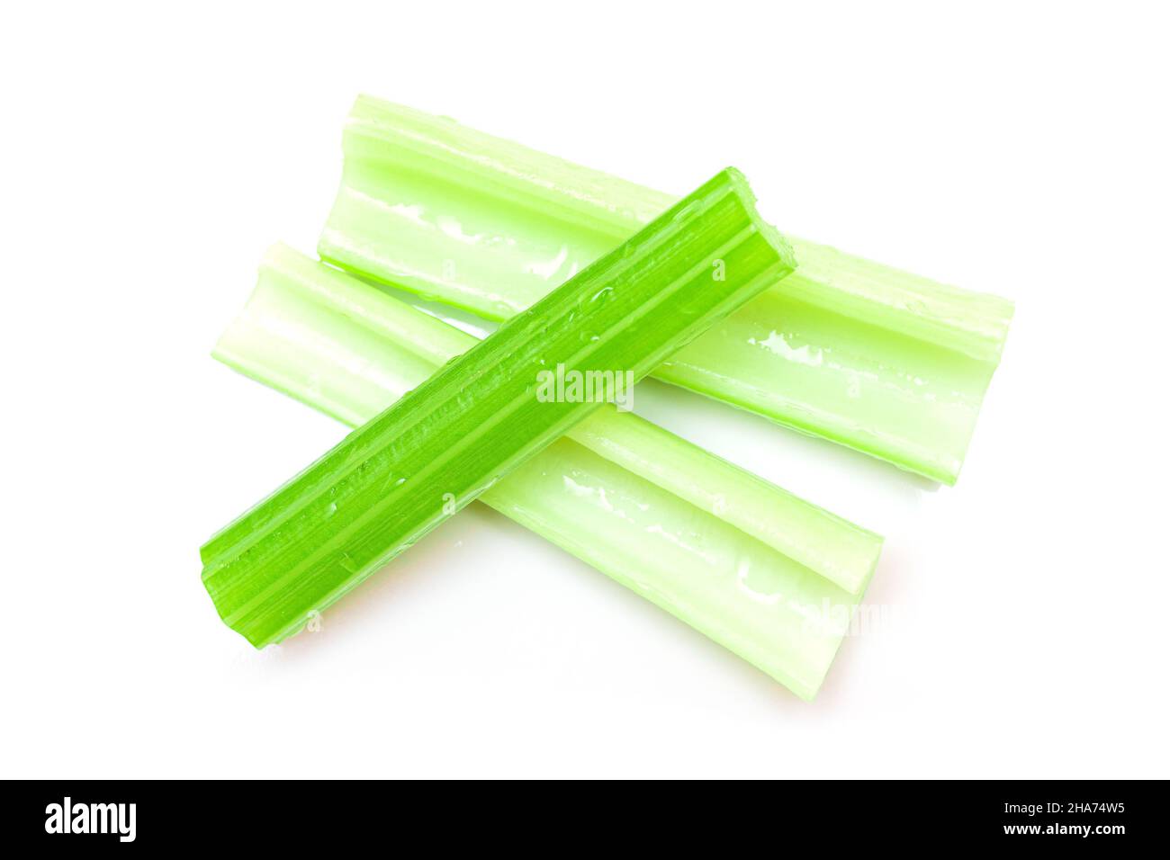 Fresh Chopped Celery Sticks with Water Drops Isolated on White