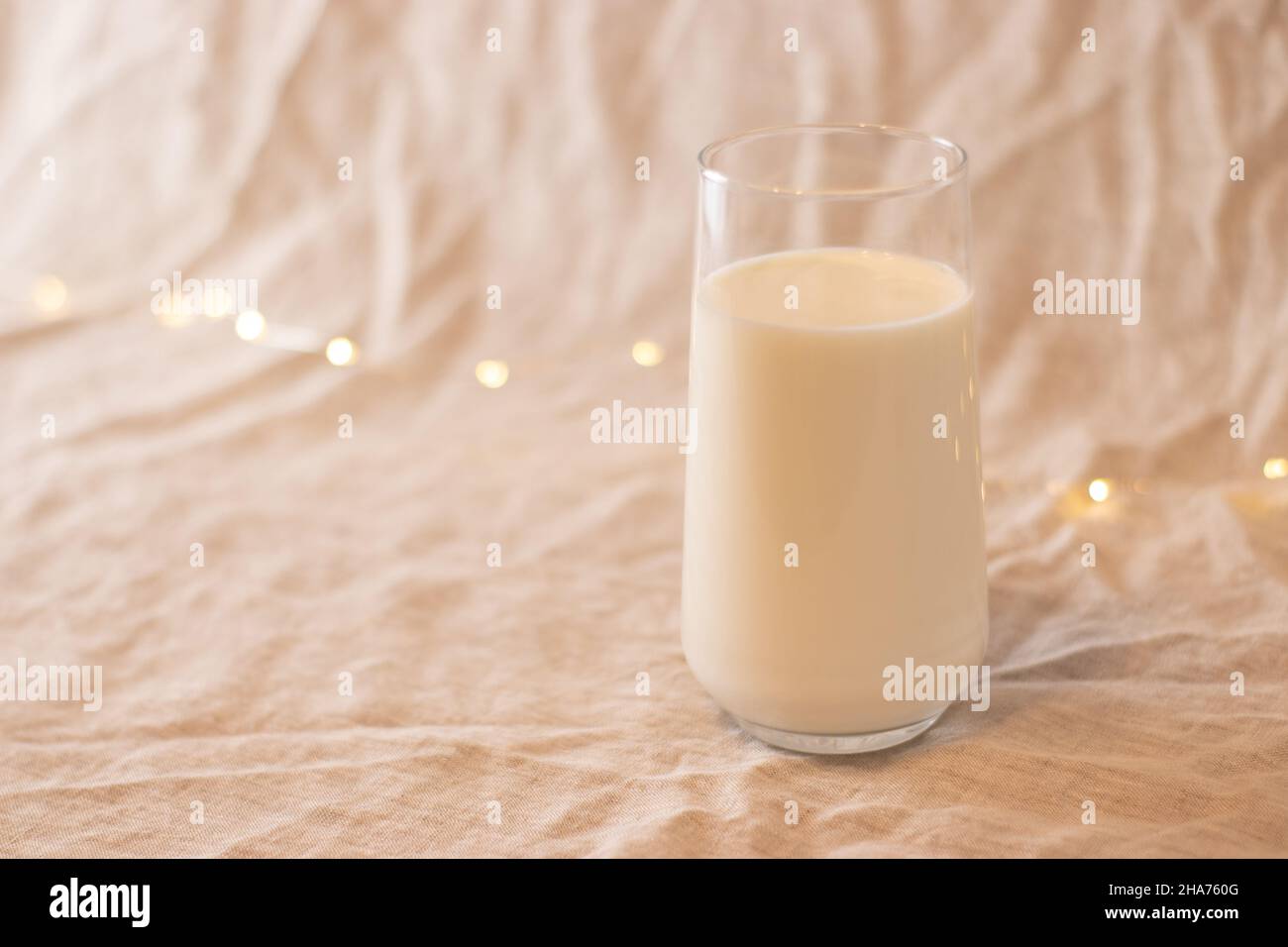milk in glass, on white fabric Stock Photo