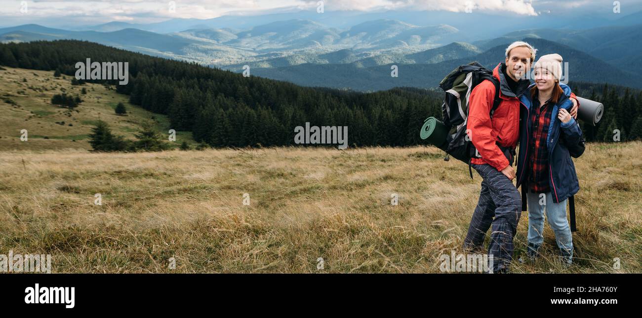 Happy man woman hiking mountains hi-res stock photography and images ...
