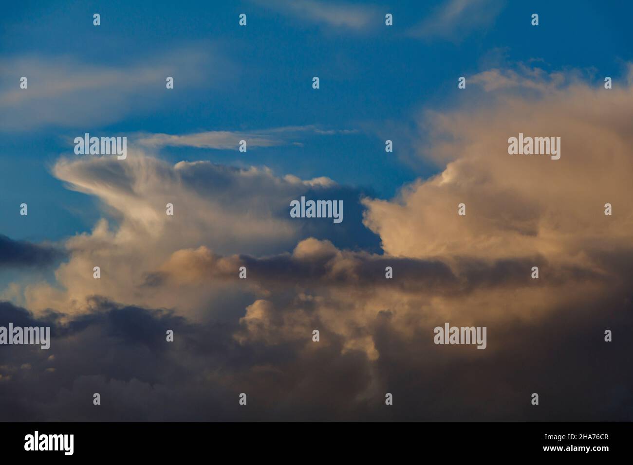 Cumulus clouds against a blue sky Stock Photo