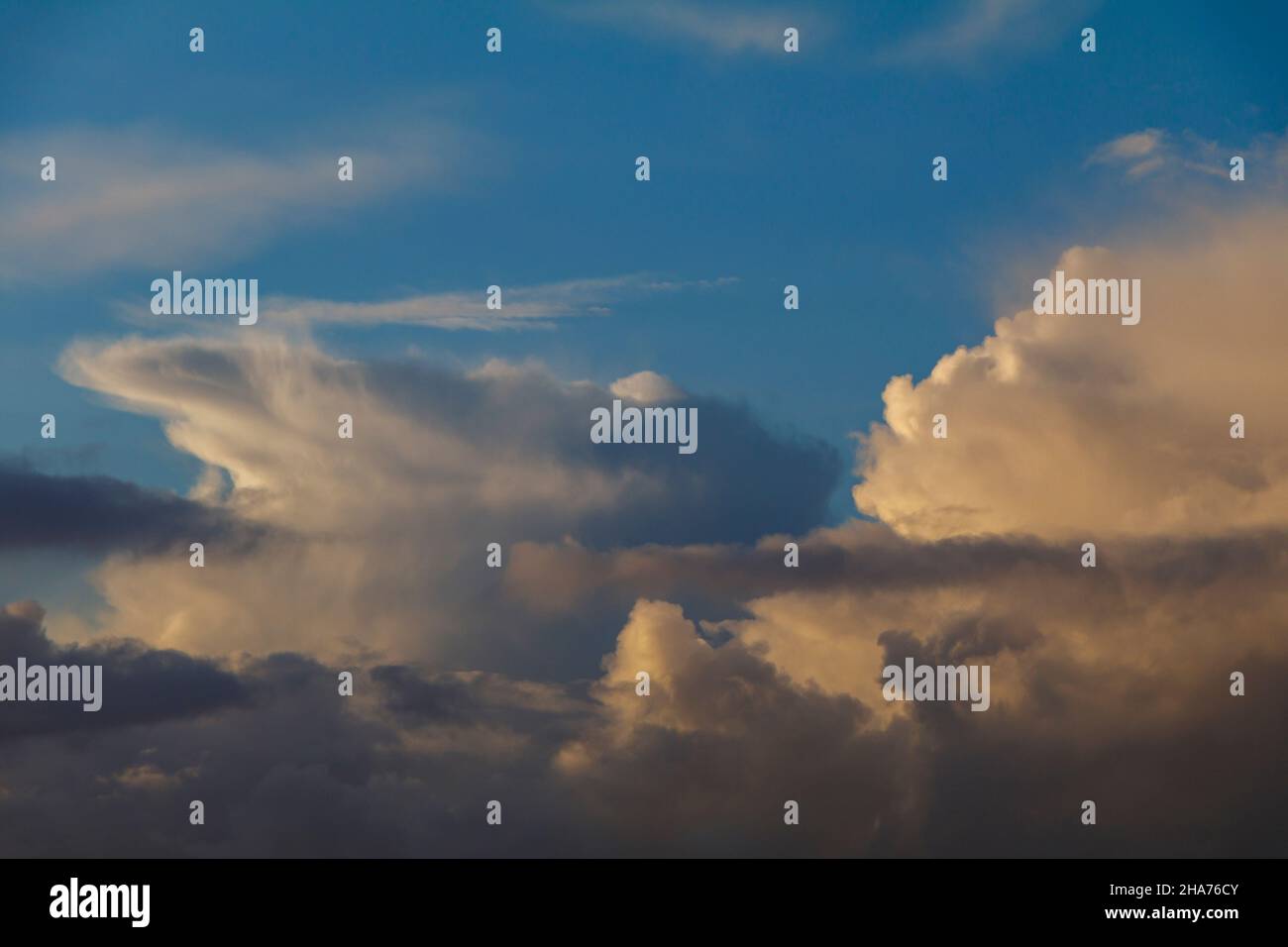Cumulus clouds against a blue sky Stock Photo