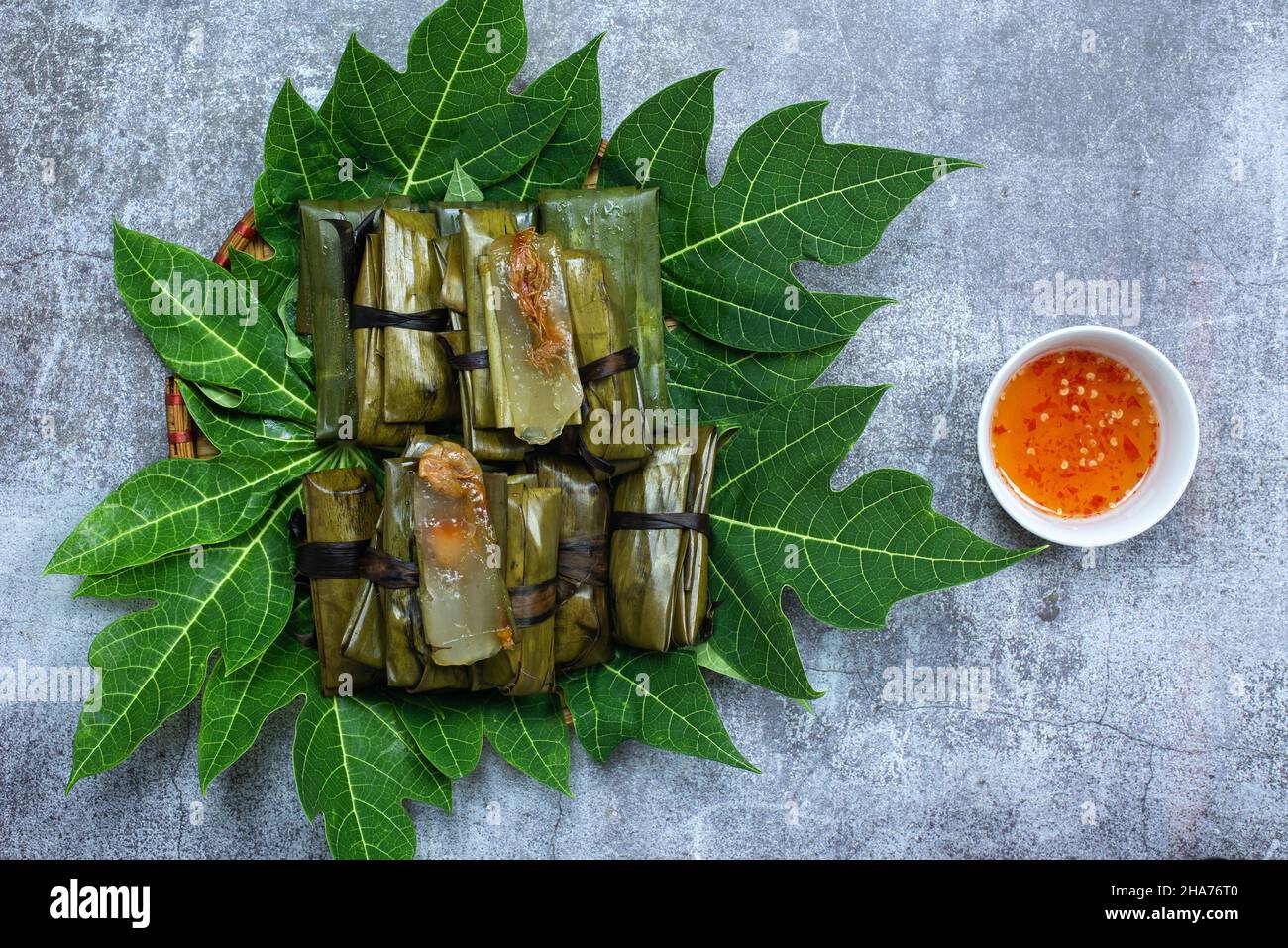 Banh bot loc is a cake made from tapioca flour with ingredients including bruised meat, shrimp and a mixture of traditional Vietnamese spices. Stock Photo