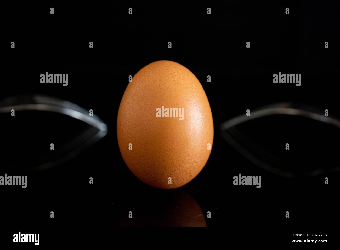 Chicken eggs with shells on a black background Stock Photo - Alamy