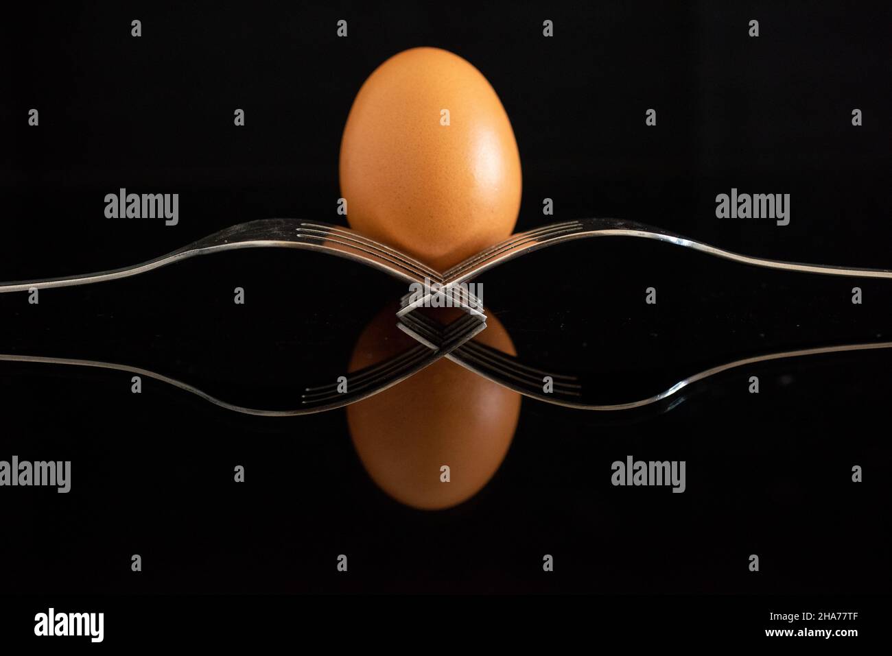 Chicken eggs with shells on a black background Stock Photo - Alamy