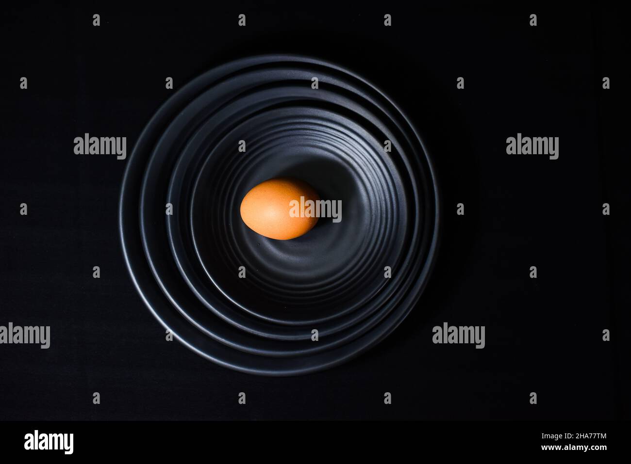 Chicken eggs with shells on a black background Stock Photo - Alamy