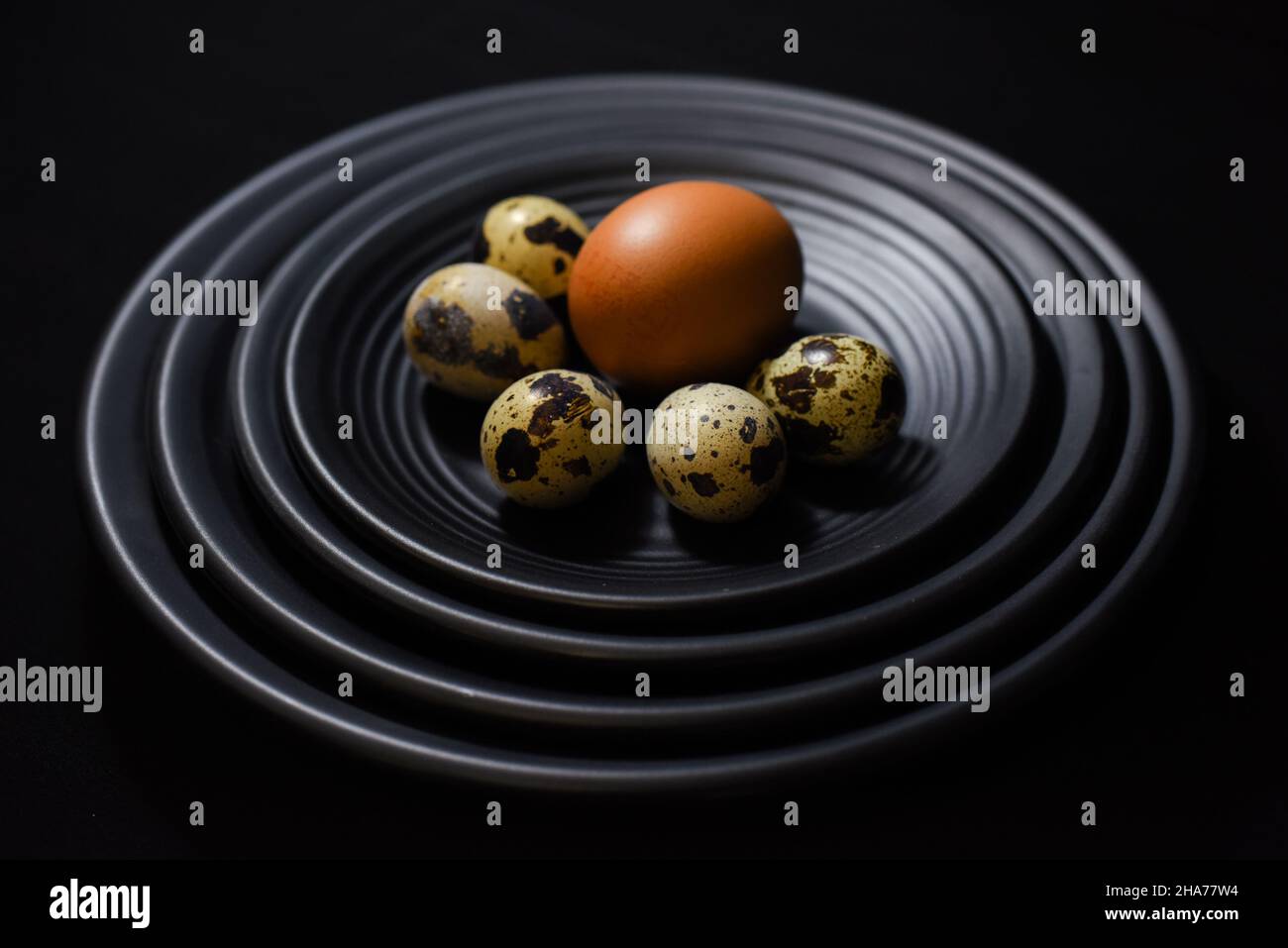 Chicken eggs with shells on a black background Stock Photo - Alamy