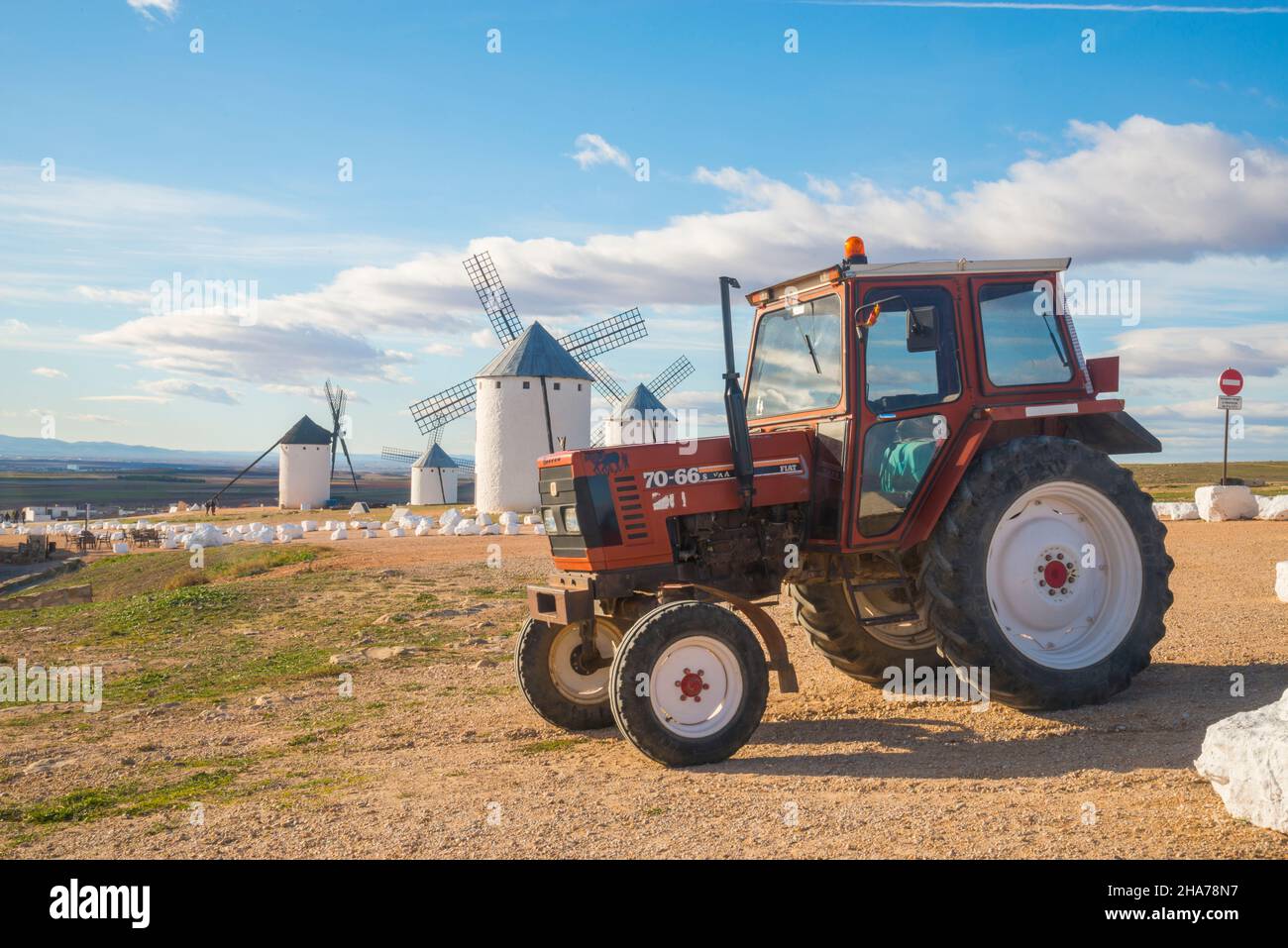 Tractor and windmills. Campo de Criptana, Ciudad Real province, Castilla La Mancha, Spain. Stock Photo