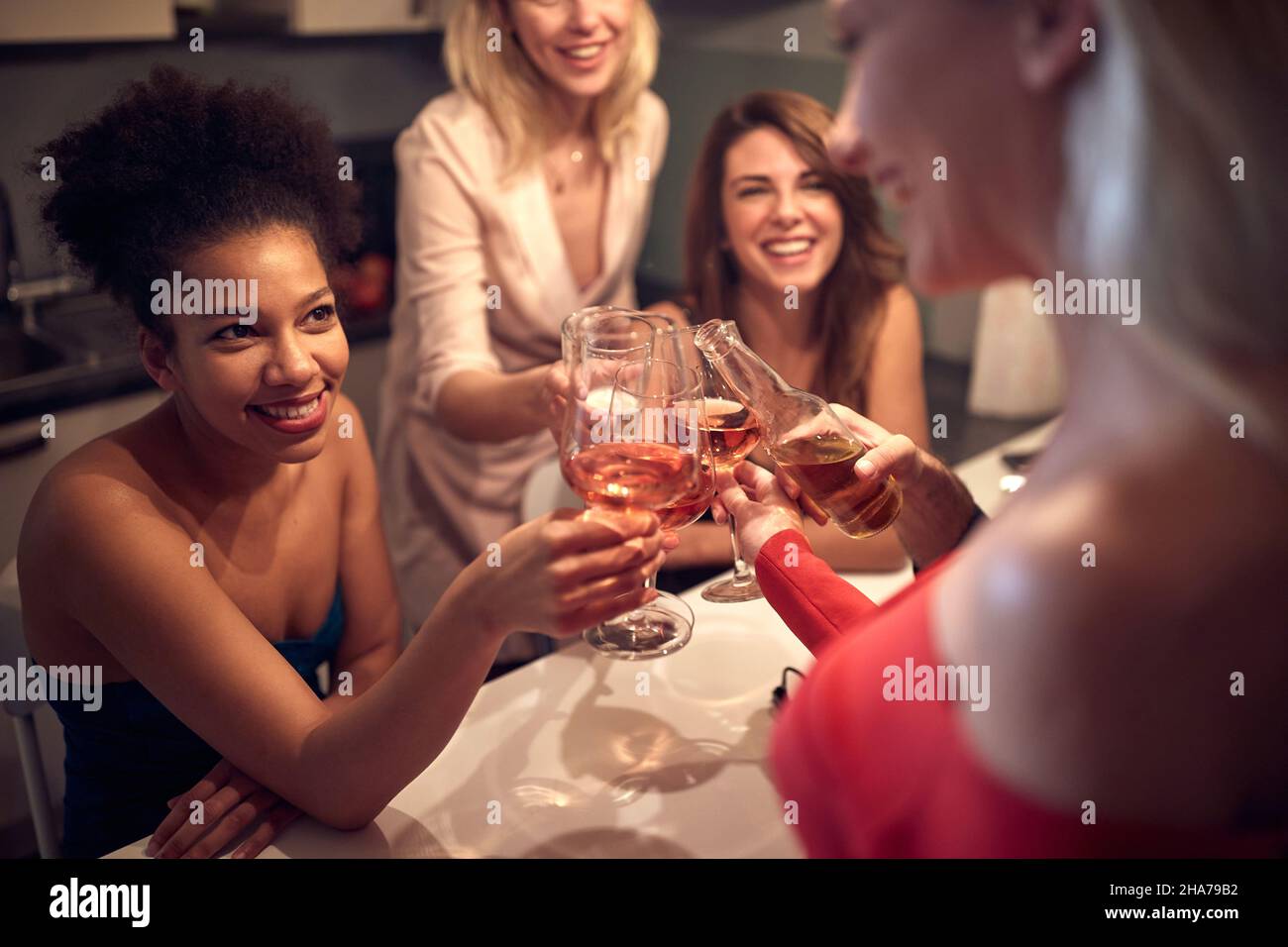 Happy friends together cheering and toasting celebrating Stock Photo
