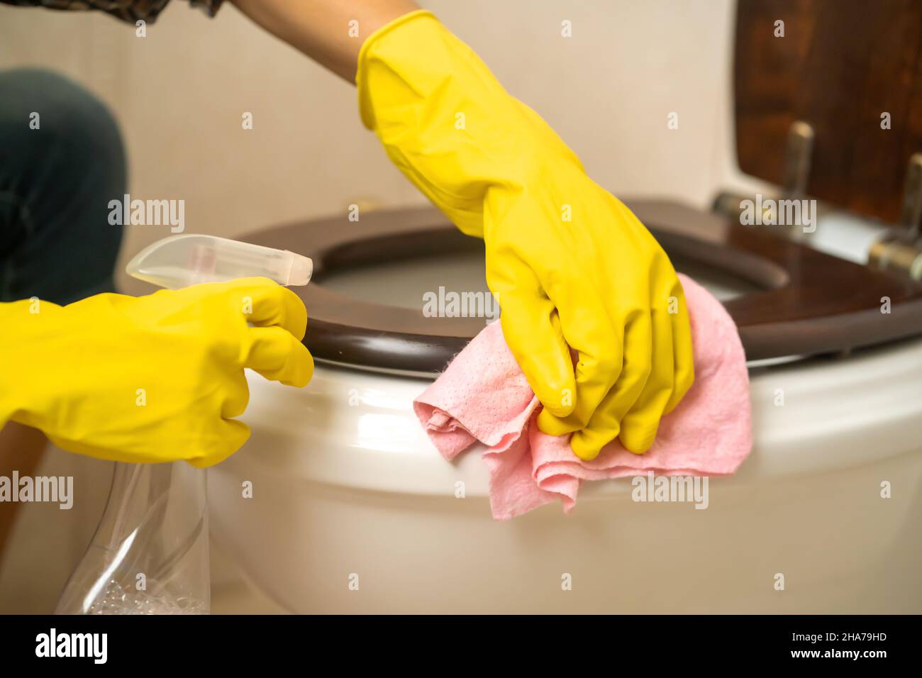 Girl is cleaning house with a detergent Stock Photo Alamy