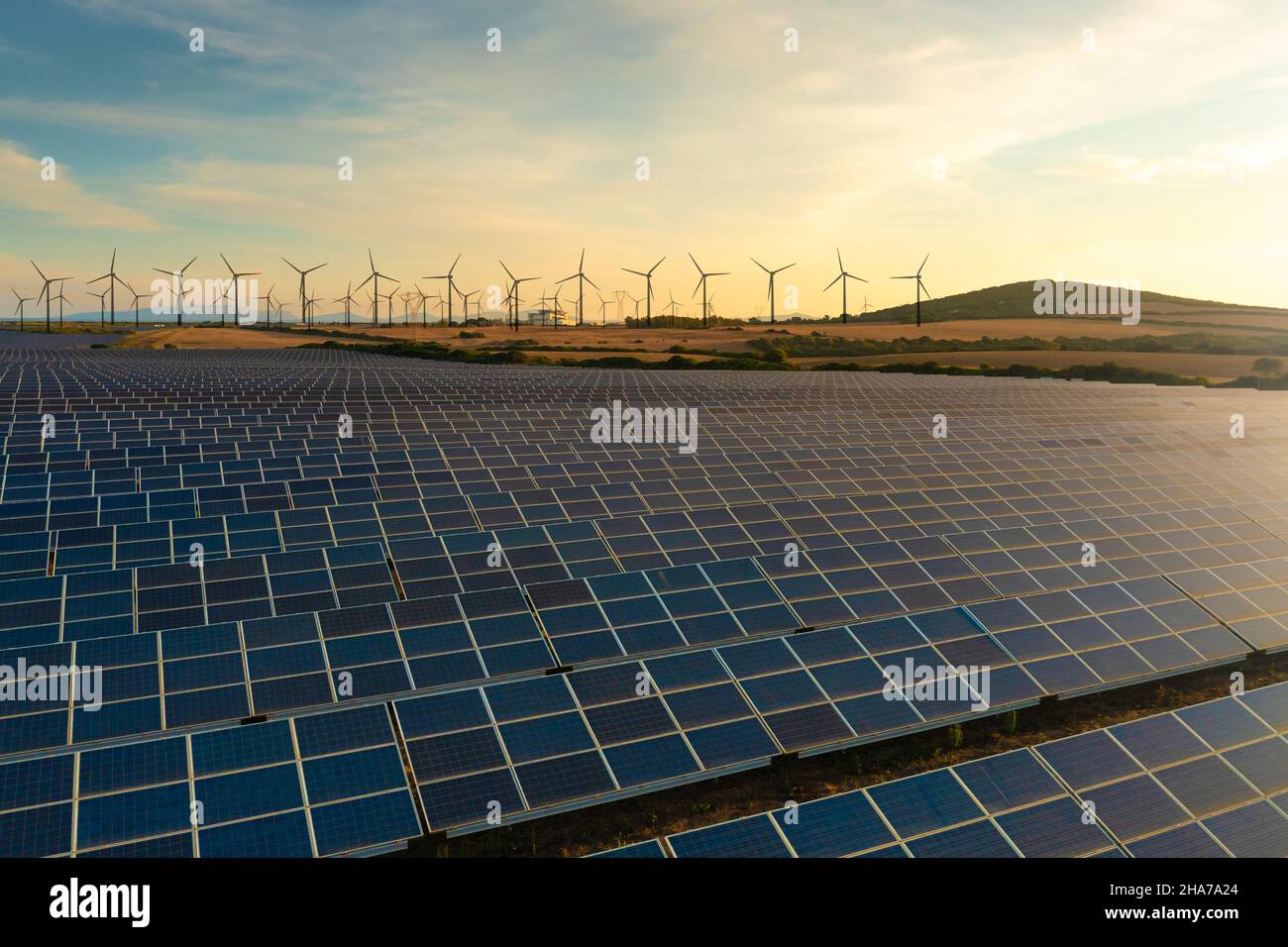 Solar panels and wind turbines generating renewable energy for green ...