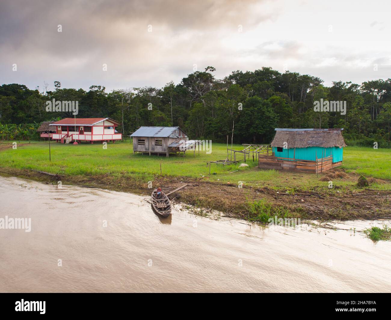Amazon River, Peru - May, 2016: Small village on the bank of the Amazon ...
