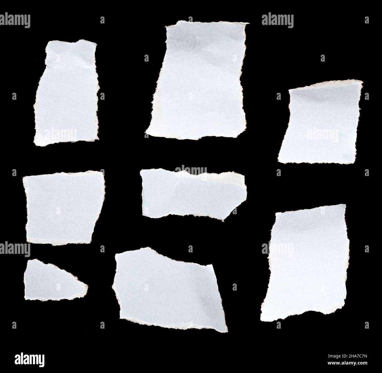 White torn paper on black background Stock Photo