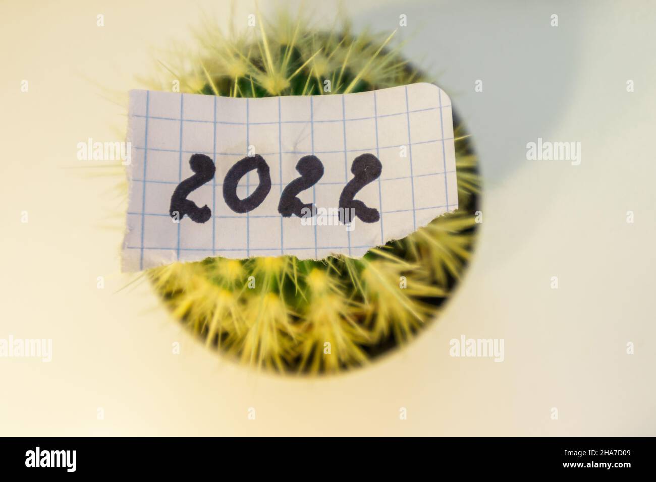 The number 2022 is written on a piece of paper.  Stock Photo