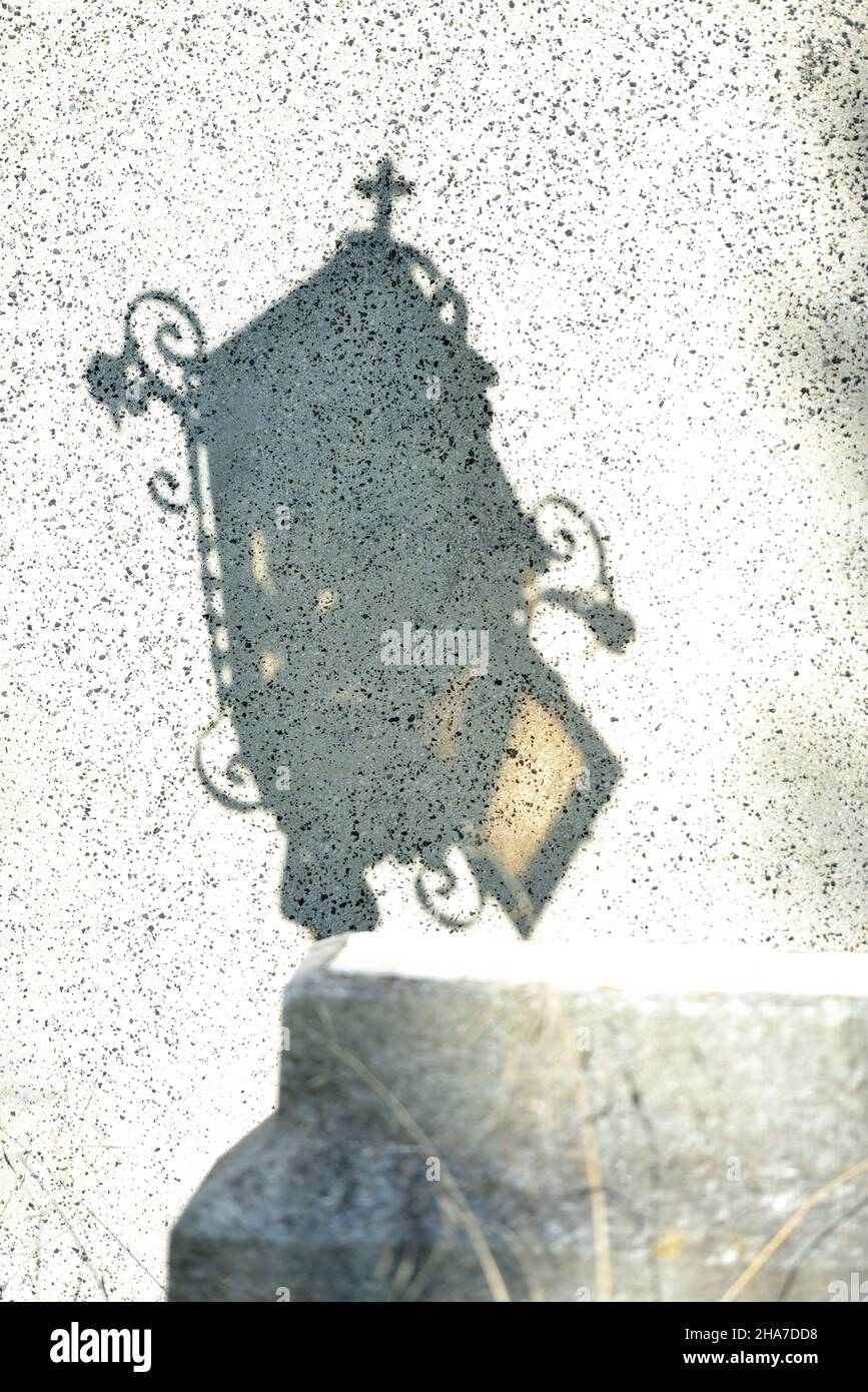 Vienna, Austria. TheVienna Central Cemetery. Shadow of a grave lantern on a tombstone Stock Photo