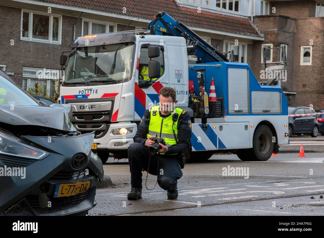 Police Photographer At A Car Accident At Amsterdam The Netherlands 7-12-2021 Stock Photo