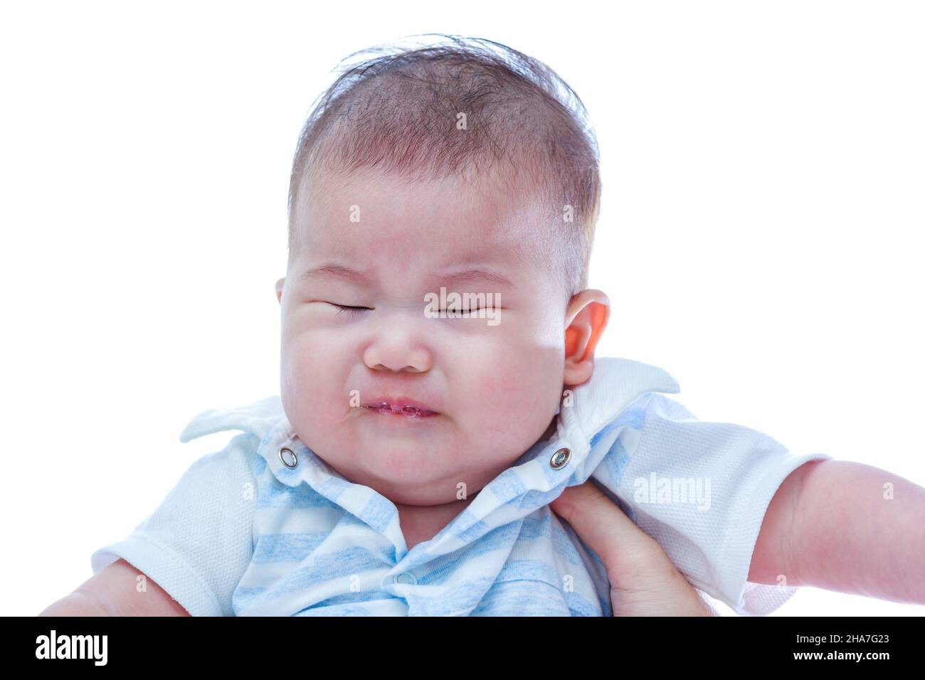 Closeup a three months asian baby crying. Angry little girl with sad and grief, on white background. Negative human emotion, facial expression feeling Stock Photo