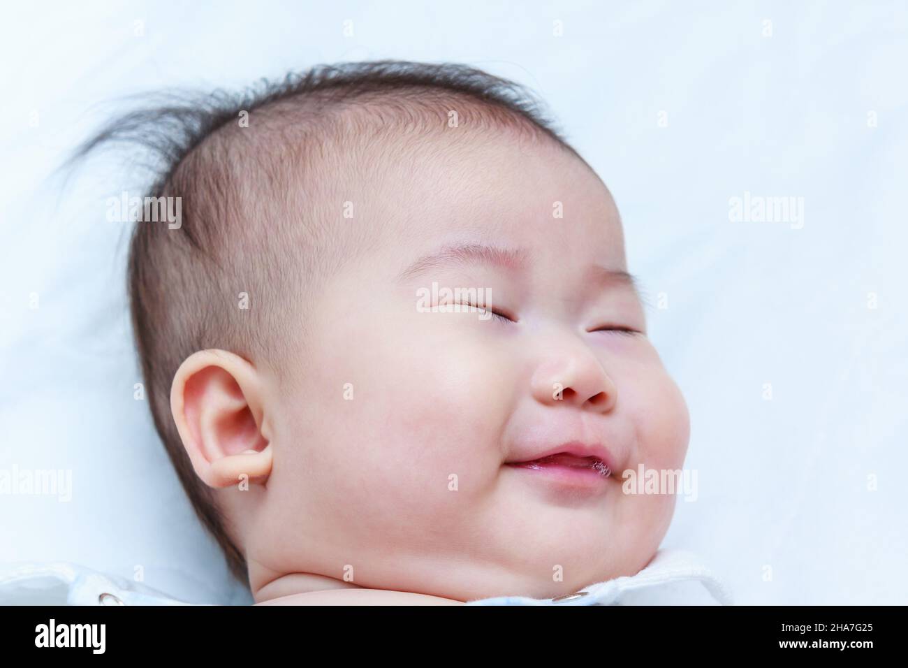 Healthy children. Closeup cute asian baby sleep sweet dreams. A three