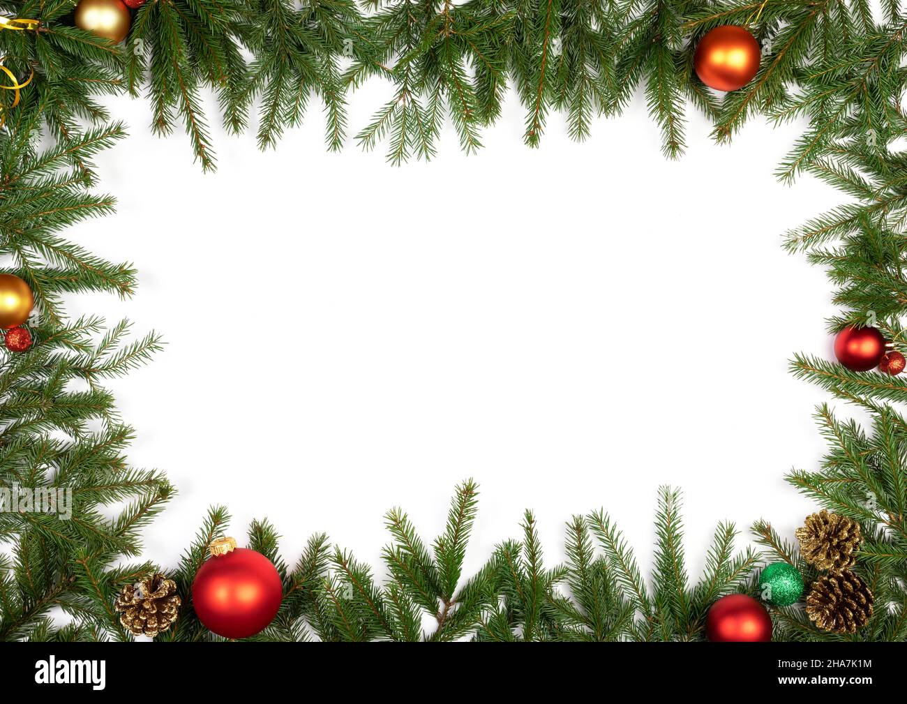 Christmas frame made of fir branches baubles and cones on white ...