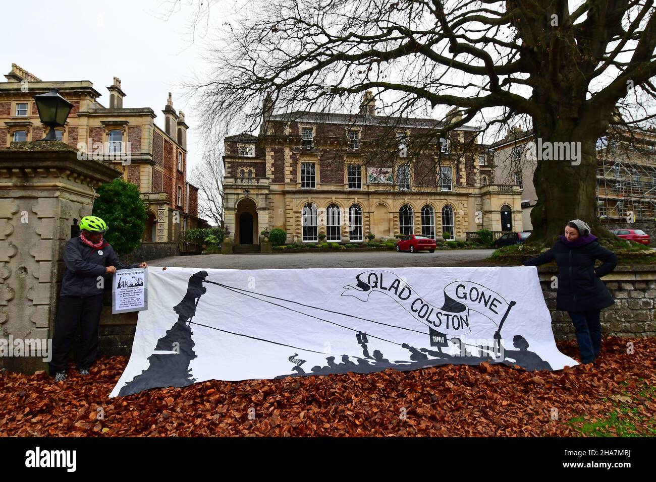 Bristol, UK. 11th Dec, 2021. On a mild and damp morning a large white Banner with Glad Colston Gone was drapped over the front wall of Merchant Hall on the promenade clifton in Bristol. This is about the Toppling of The Colston Statue in the city a year ago. This is the eve of the Eight Day Trial set to begin on Monday.Merchants Hall is the Headquarters of the society of the Merchant Ventures. Credit: Robert Timoney/Alamy Live News Stock Photo