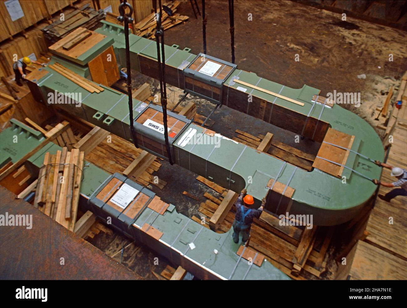 Heavy lift. Magnetic core being loaded into the hold of a multipürpose vessel in the Port of Hambug, Germany. Stock Photo