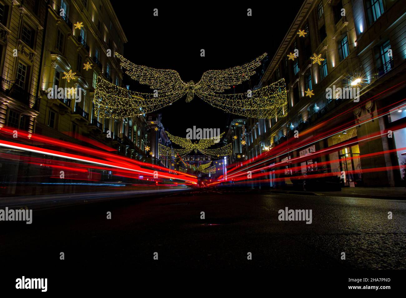 Regent Street in London at Christmas with busy traffic and decorations Stock Photo