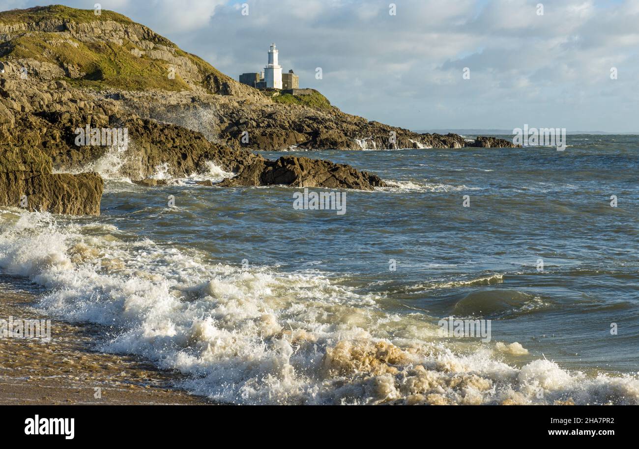 Mumbles Lighthouse on the South Wales coast near Bracelet Bay on the Gower Peninsula Stock Photo