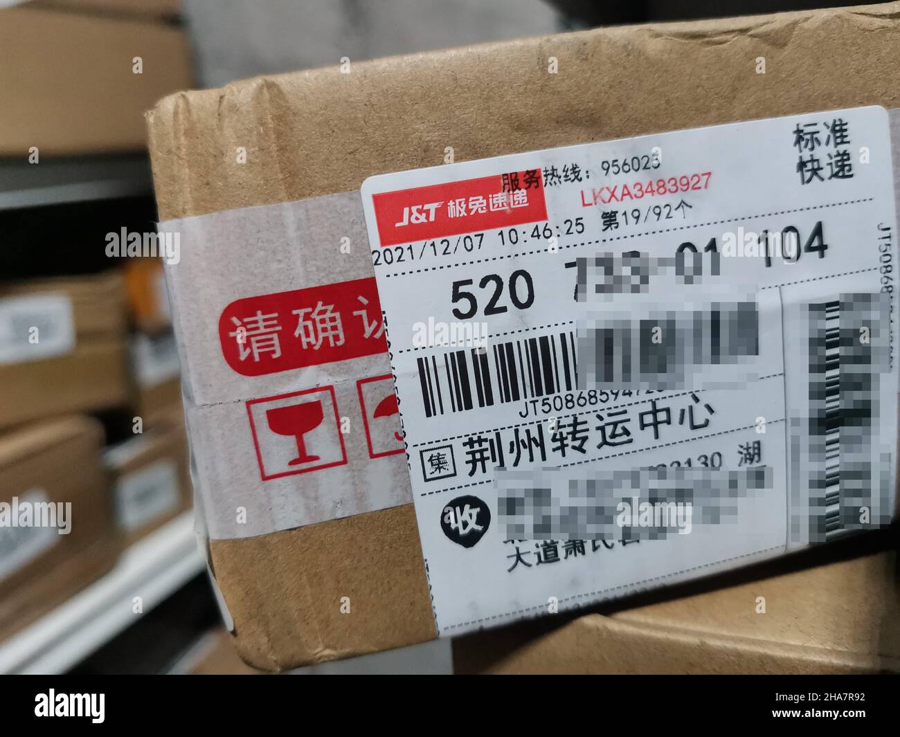 YICHANG, CHINA - DECEMBER 11, 2021 - A package is delivered by JT Express in Yichang, Hubei Province, China, Dec 11, 2021. Best Group agreed to transf Stock Photo