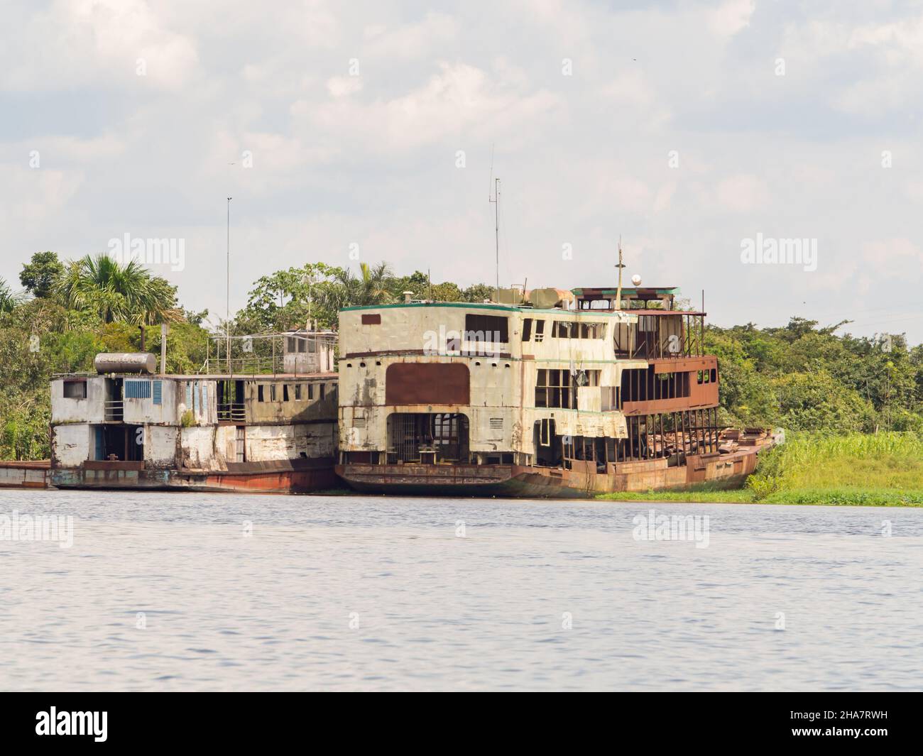 Iquitos, Peru- Dec , 2017: Abandoned, rusty boats on the bank of