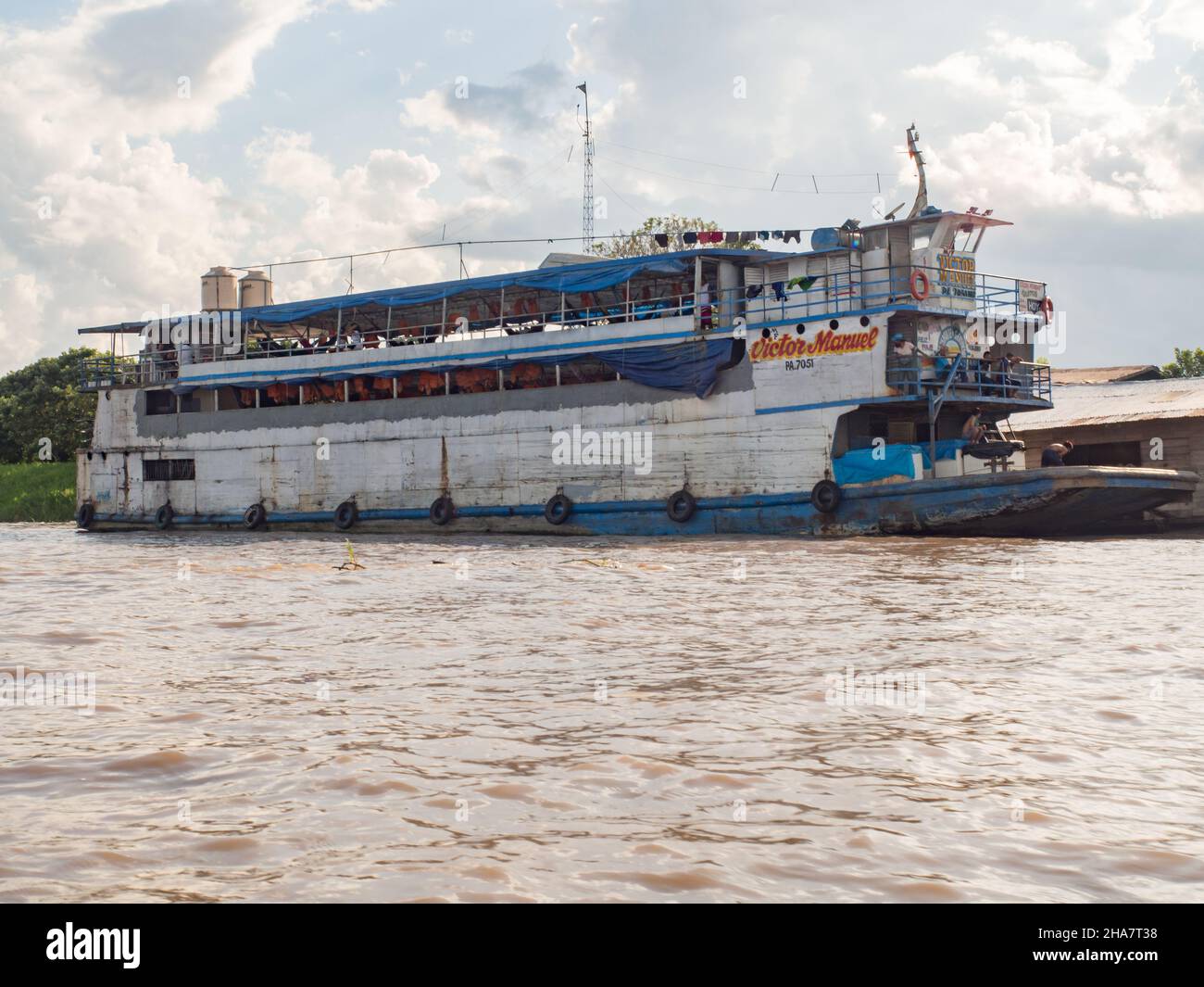 Santa Rosa, Peru - Dec, 2017: Cargo boat on the Amazon river in the small port in Santa Rosa. Amazonia. South America. Stock Photo