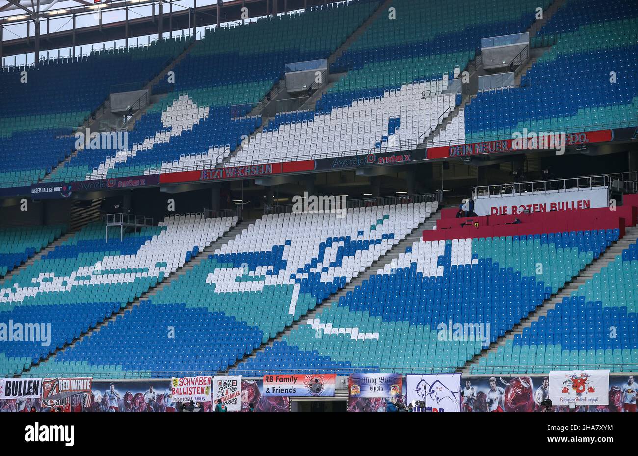 Leipzig, Germany. 11th Dec, 2021. Football: Bundesliga, Matchday 15, RB Leipzig - Borussia Mönchengladbach at the Red Bull Arena. A stylised bull made of coloured seat shells can be seen in the empty stands. Credit: Jan Woitas/dpa-Zentralbild/dpa - IMPORTANT NOTE: In accordance with the regulations of the DFL Deutsche Fußball Liga and/or the DFB Deutscher Fußball-Bund, it is prohibited to use or have used photographs taken in the stadium and/or of the match in the form of sequence pictures and/or video-like photo series./dpa/Alamy Live News Stock Photo