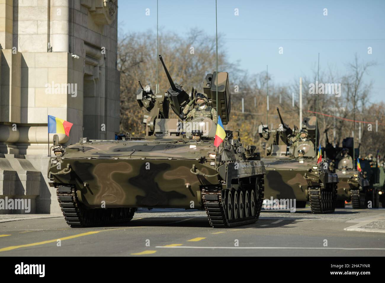 BUCHAREST, ROMANIA - December 1, 2021: MLI 84 M combat armored vehicle, at Romanian National Day military parade passes under the Arch of Triumph Stock Photo