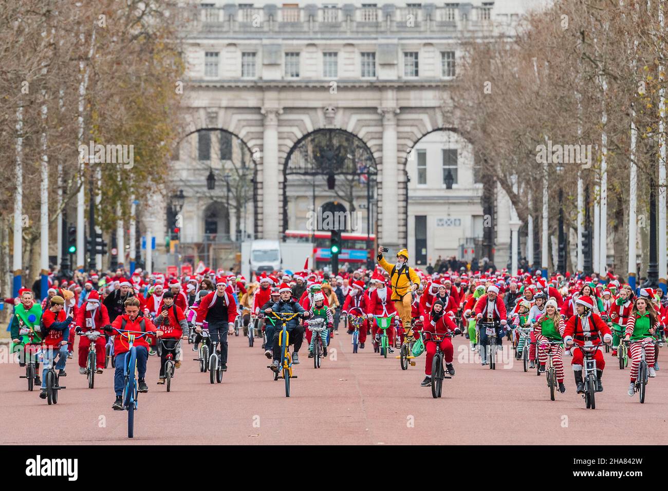 London, UK. 11th Dec, 2021. Riding down the Mall in Sant suits - The BMX Life Santa Cruise bike ride in support of the ECHO (Evelina Childrens Heart Organisation) children's heart charity. Credit: Guy Bell/Alamy Live News Stock Photo