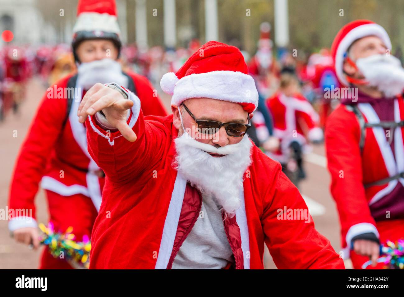 London, UK. 11th Dec, 2021. Riding down the Mall in Sant suits - The BMX Life Santa Cruise bike ride in support of the ECHO (Evelina Childrens Heart Organisation) children's heart charity. Credit: Guy Bell/Alamy Live News Stock Photo