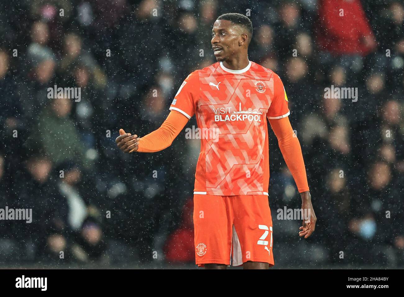 Marvin Ekpiteta 21 of Blackpool gives his team instructions Stock