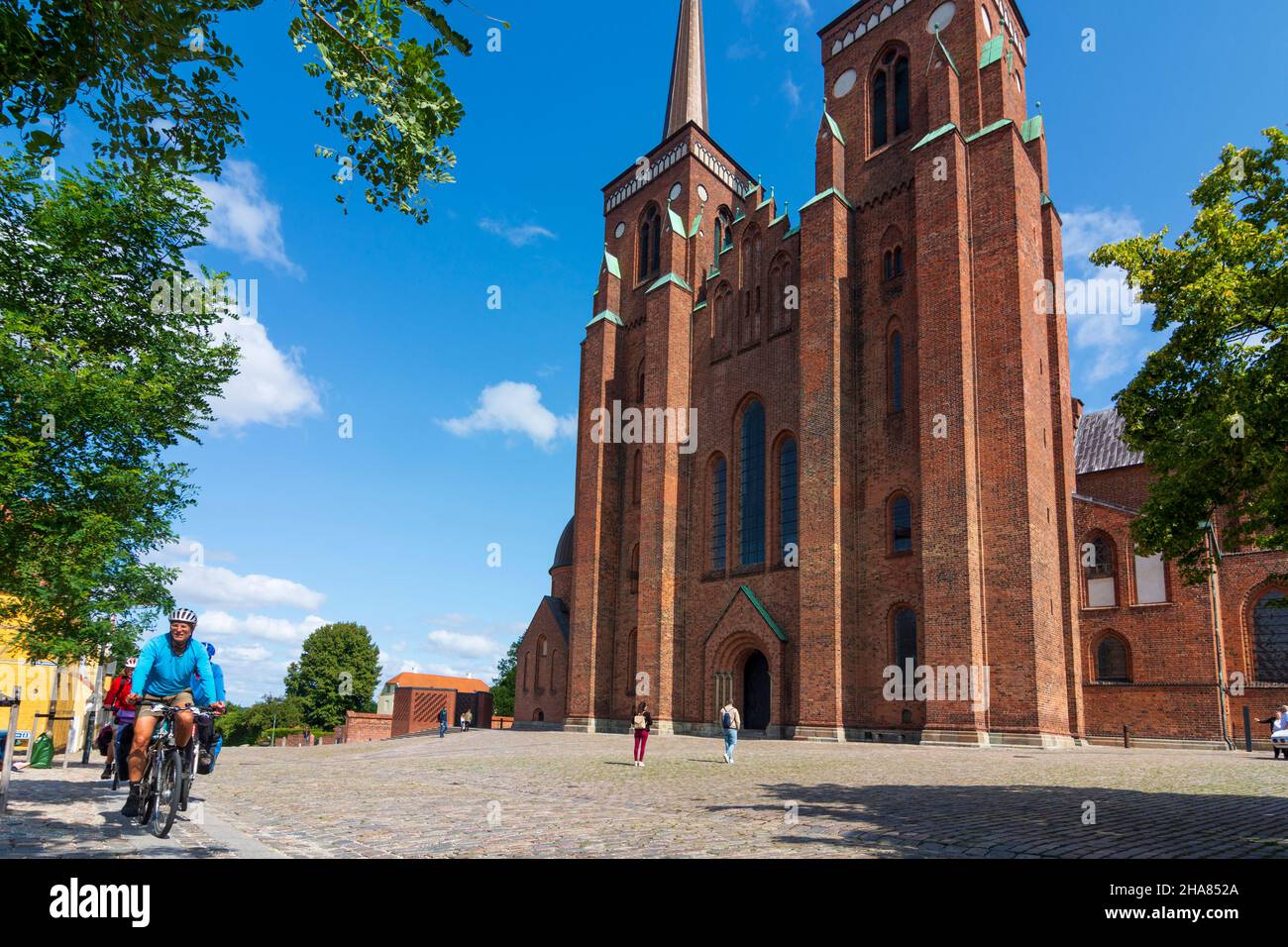 Roskilde: Roskilde Cathedral, cyclists, in Roskilde, Zealand, Sealand ...