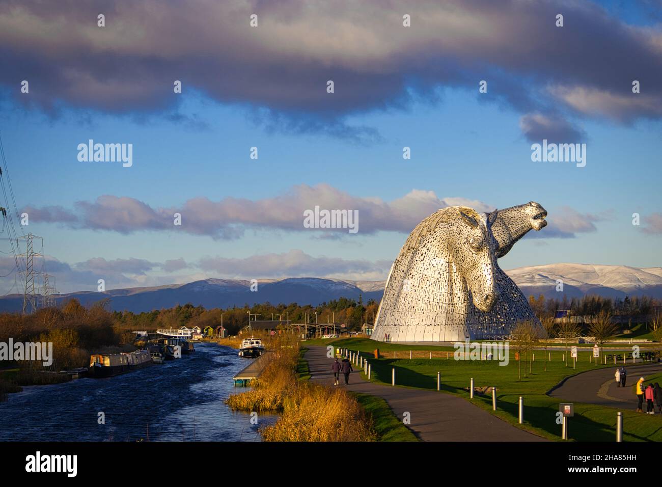 View of the snowy hills behind the Kelpies in Falkirk with the Canal running alongside in bonny Scotland Stock Photo