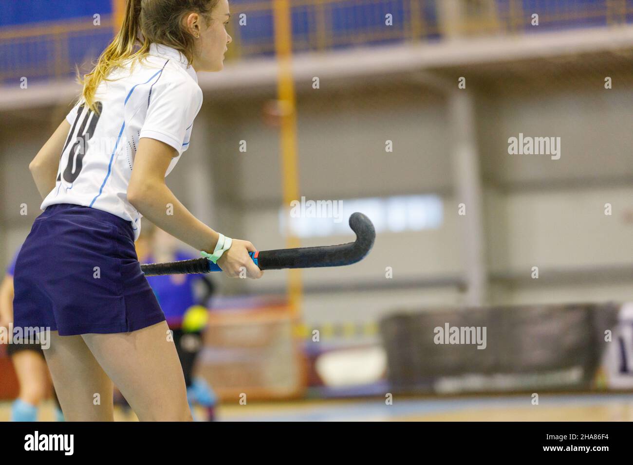 Young girl hockey player playing indoor hockey Stock Photo Alamy
