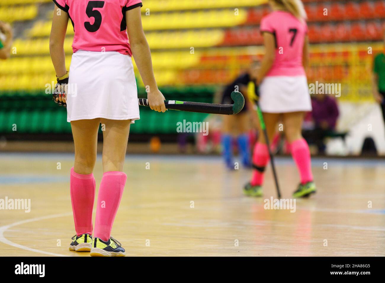 Young girl hockey player playing indoor hockey Stock Photo Alamy