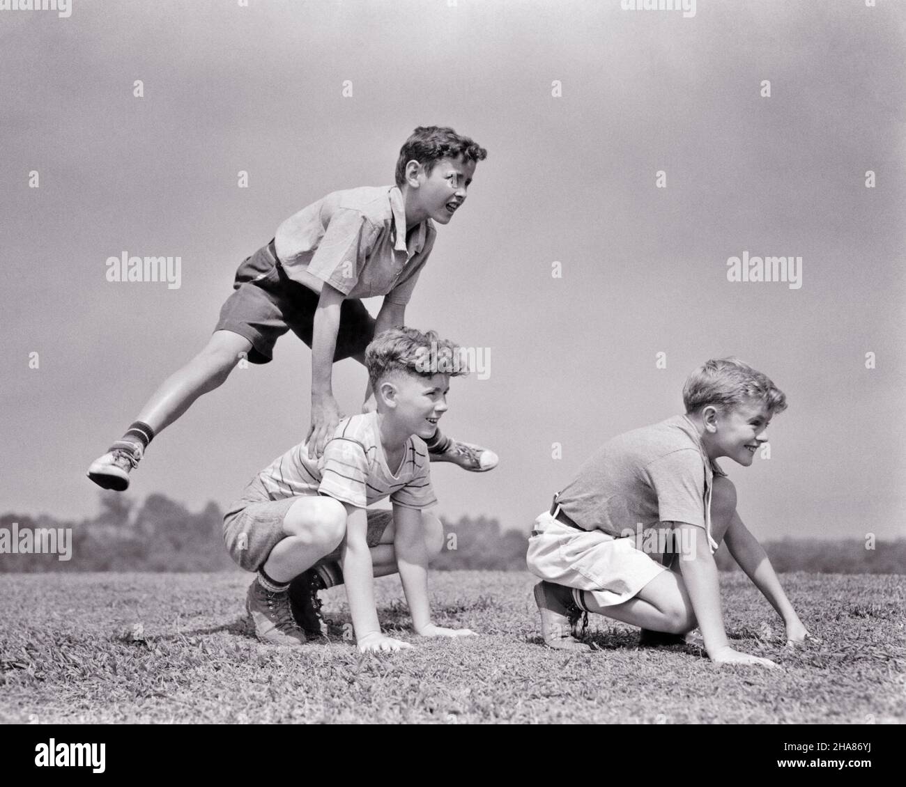 1930s THREE BOYS IN A ROW JUMPING PLAYING LEAP FROG - b4388 HAR001 HARS ...