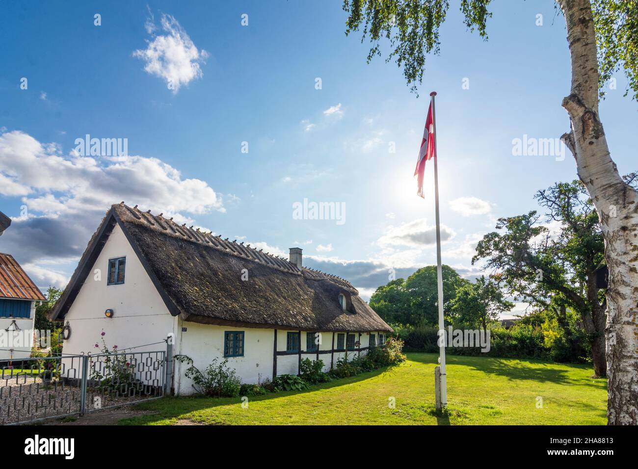 Stevns: thatched roof house, Danish flag, in , Zealand, Sealand