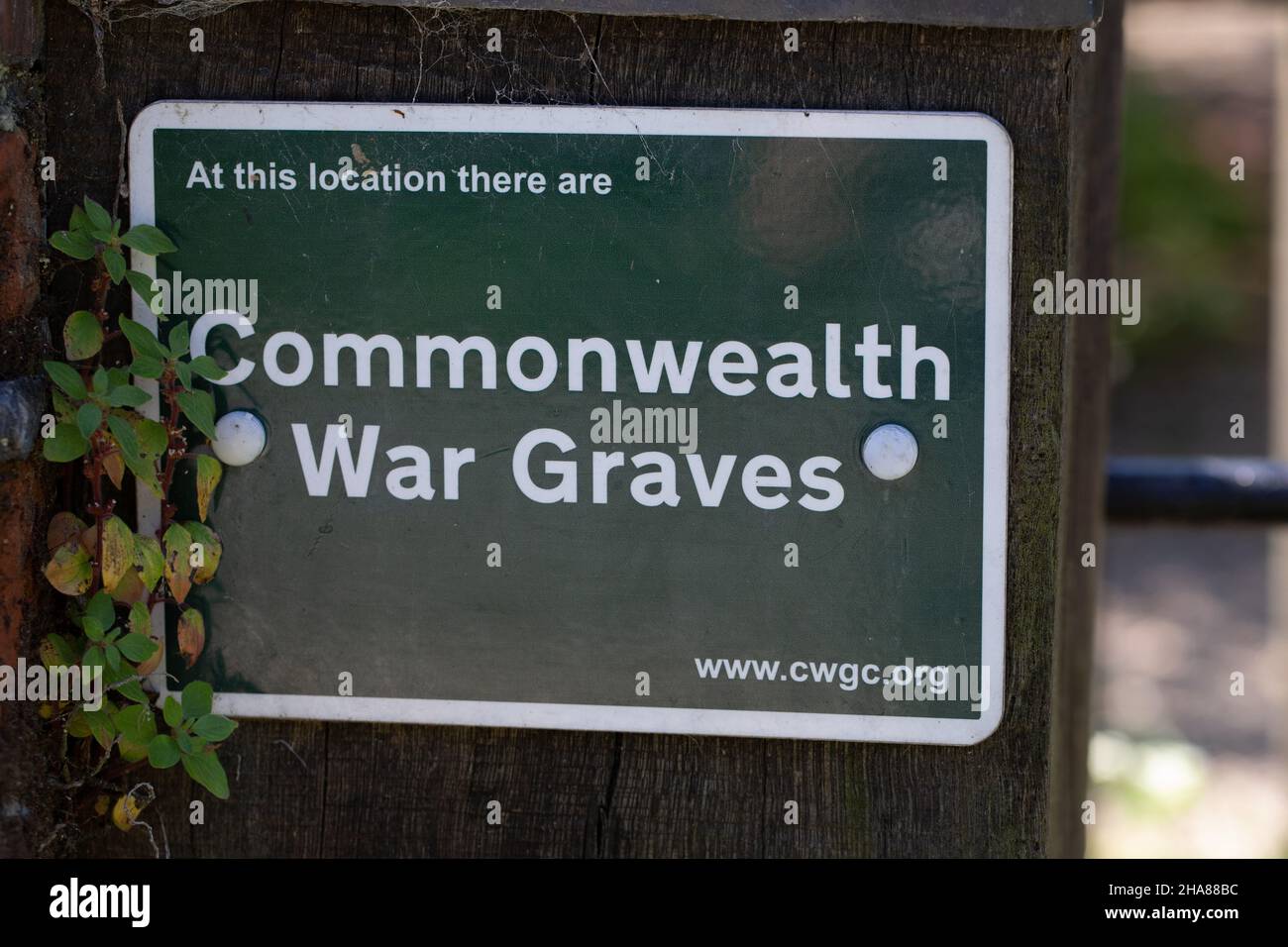Notice, sign, Commonwealth War Graves, at this location. North Repps church yard. Recognition and rememberance of those who died in World War  1 and 2 Stock Photo