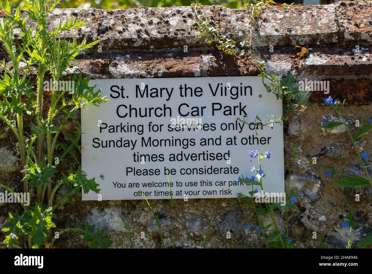 Church Car Park Sign, asking visitors, tourists, to be considerate in accepting limited period occupying parking spaces meant for worshipers on Sunday. Stock Photo