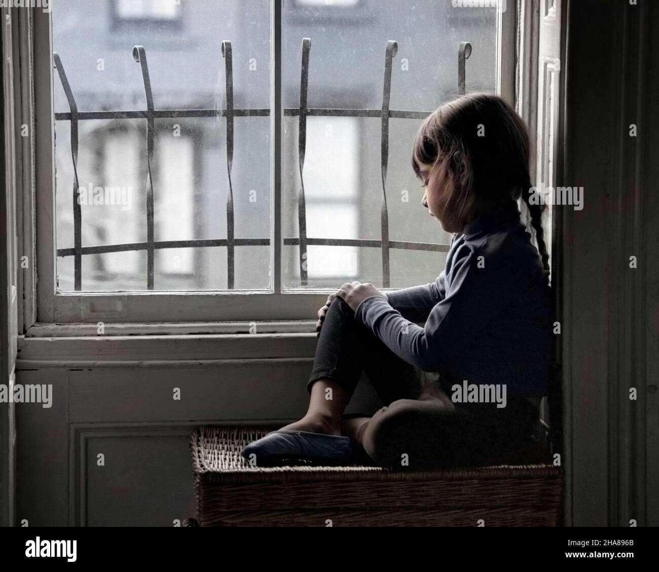 1960s SAD LONELY LITTLE GIRL LOOKING OUT THROUGH CITY APARTMENT WINDOW ...