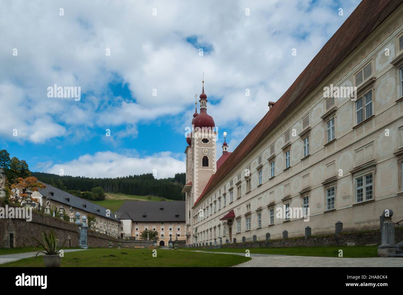 View of the long side of a monastery. with monastery garden. Stock Photo