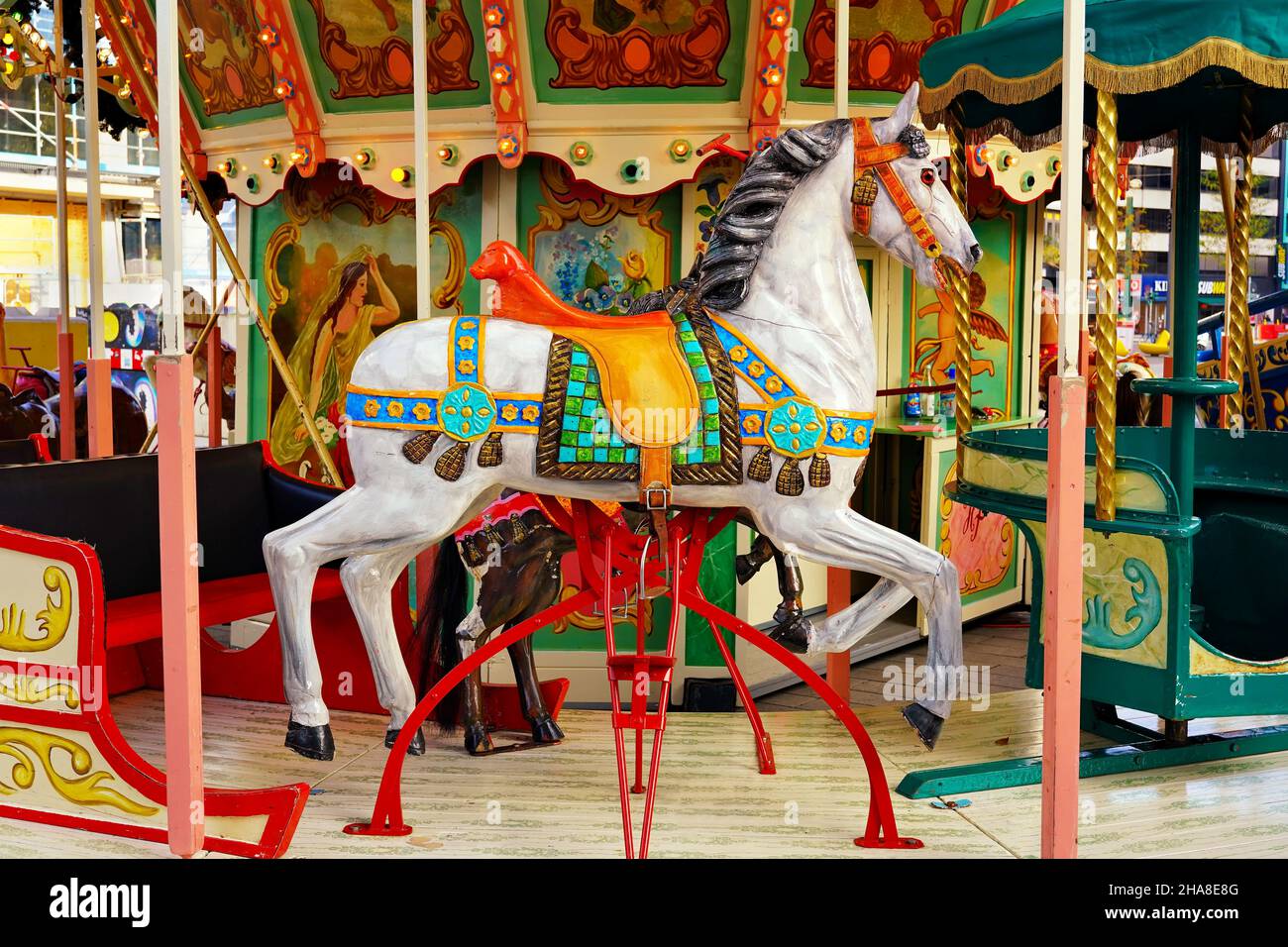 Traditional German horse carousel at the Christmas market 2021 in Düsseldorf/Germany. Stock Photo
