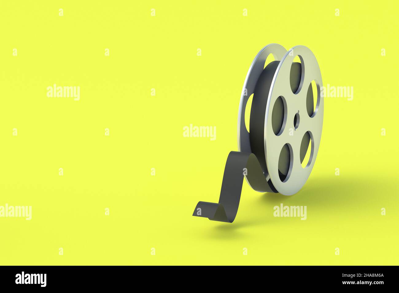 Film reel in metal frame on yellow background. Cinematography tape ...