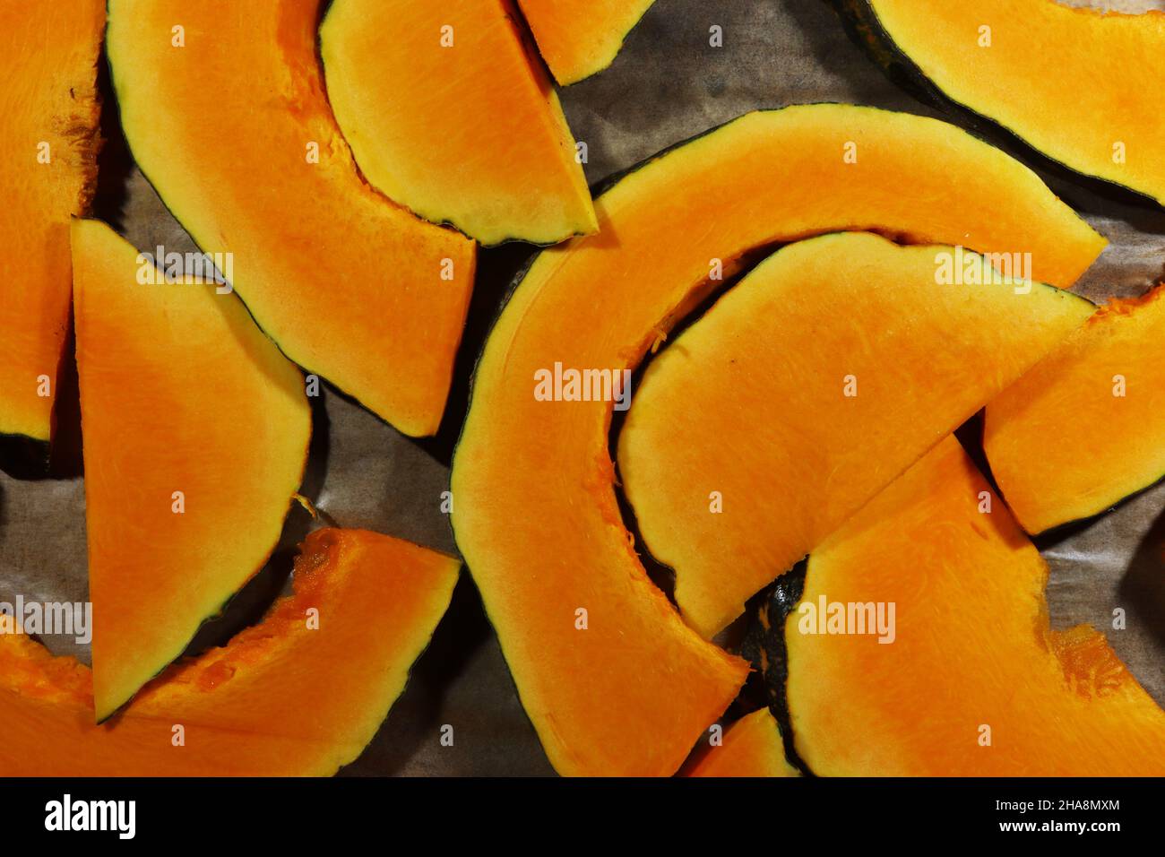 Top view of slices of black futsu squash on cooking paper Stock Photo